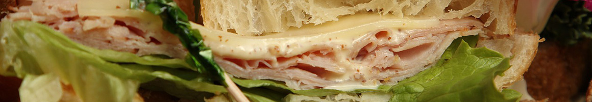 Eating Deli Sandwich at Full Belli Deli restaurant in Townsend, MT.